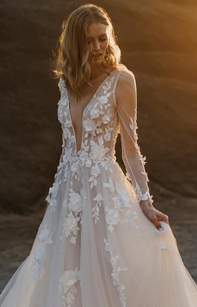 Model wearing a white Madison James gown