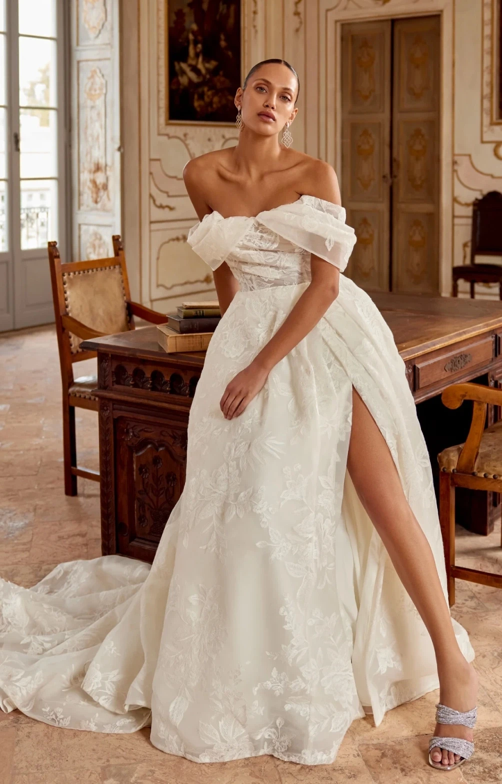 Model wearing a white Justin Alexander gown