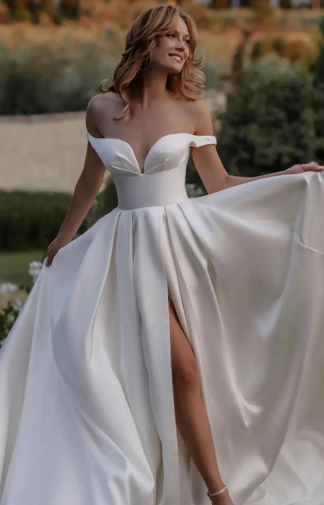 Model wearing a white Madison James gown
